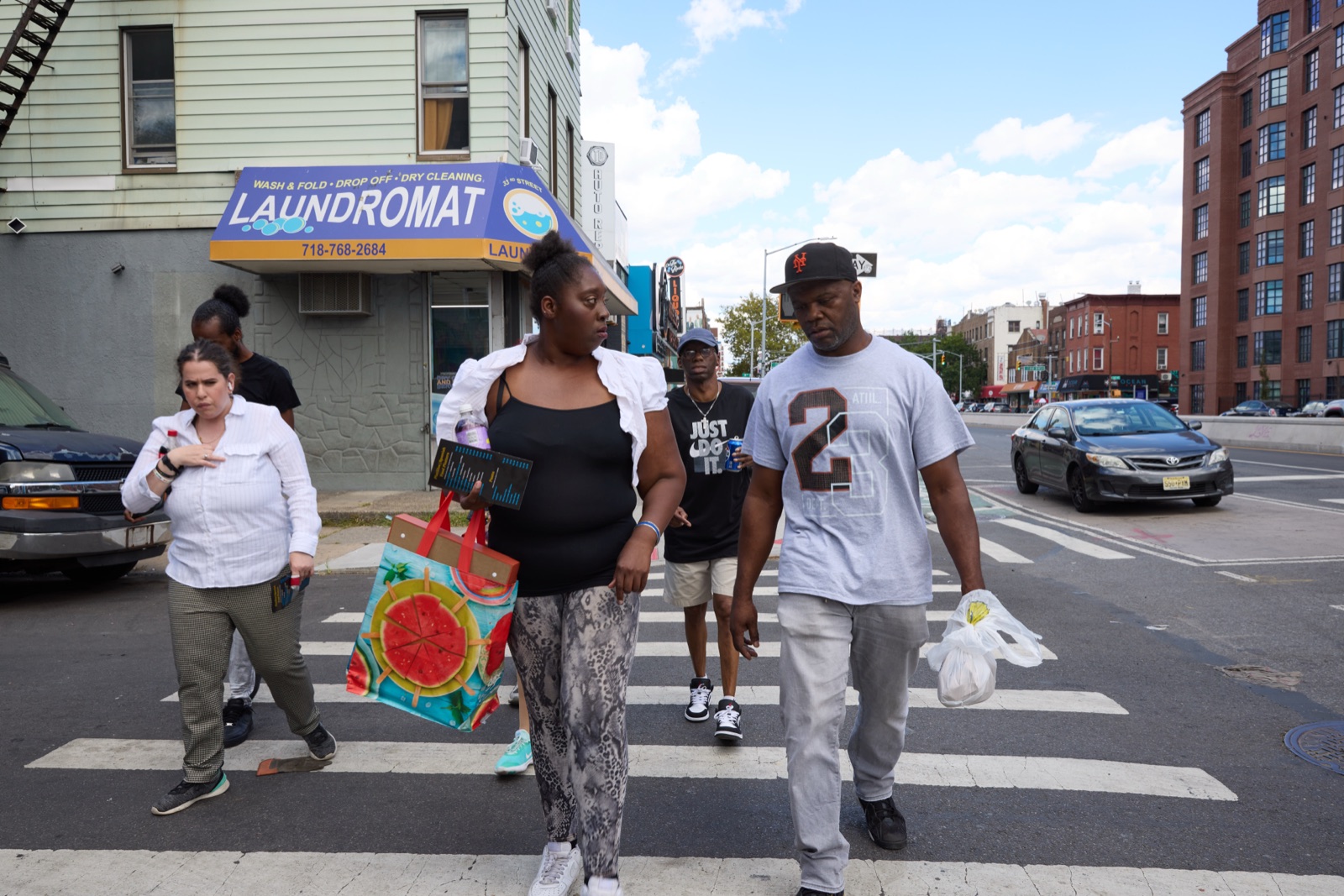 Group gathered outside a neighborhood laundromat