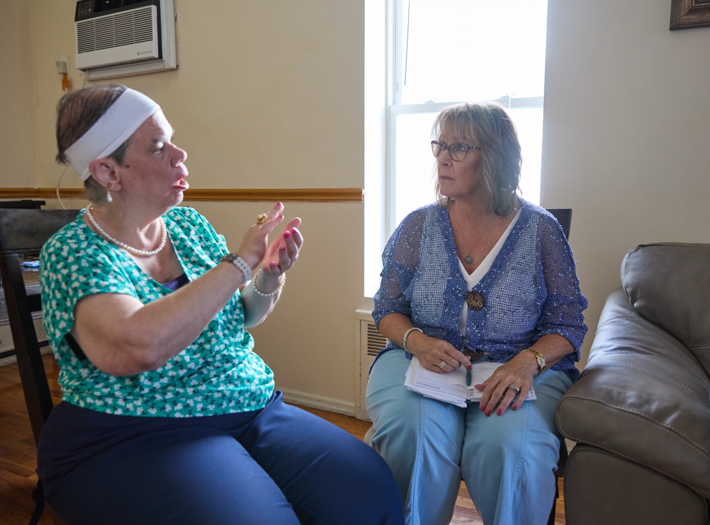 Two women in conversation during an advocacy meeting